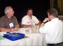 ISSA President Jerry Kramer (center) discusses snowmobile/ATV issues with Indiana delegates Len Neisler (left) and Dale Brier following the ACSA Midwest Chapter meeting at Congress.
